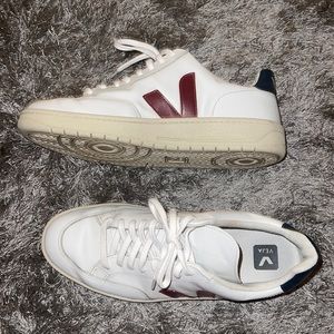 Man veja white sneakers in pristine condition